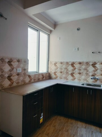 Kitchen in 3 BHK Apartment at Amrapali Golf Homes, Sector 4, Greater Noida – for Sale