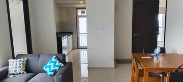 Living Room in 2 BHK Apartment at Ruparel Ariana, Parel – for Rent