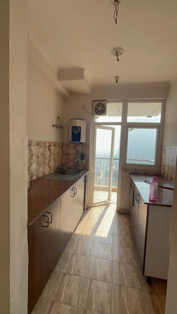 Kitchen in 2.5 BHK Apartment at Amrapali Leisure Park, Amrapali Leisure Valley – for Rent