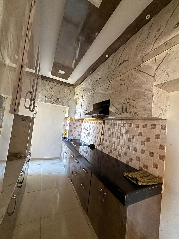 Kitchen, wave-dream-homes 2 Bedroom 808 Sq.Ft. Apartment In Wave City Ghaziabad 8353391