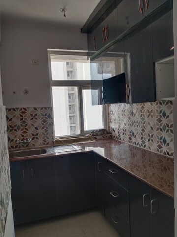 Kitchen in 2 BHK Apartment at Amrapali Leisure Park, Amrapali Leisure Valley – for Rent