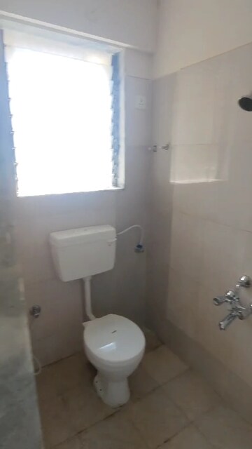Bathroom in 1 BHK Apartment at Paradigm Zenith Pushpanjali Residency Phase III, Ghodbunder Road – for Rent