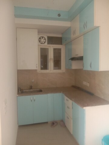 Kitchen in 2 BHK Apartment at Mahagun Mywoods, Sector 16c Greater Noida – for Rent