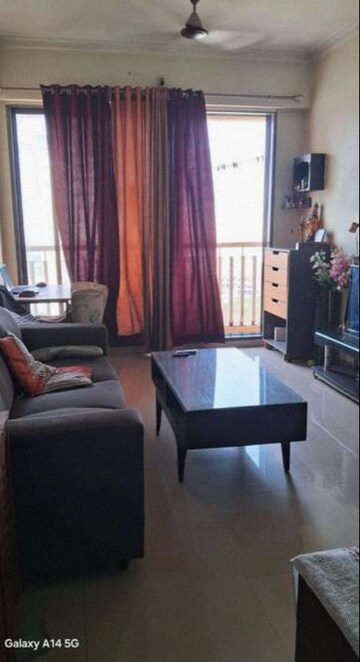 Living Room in 1 BHK Apartment at Coral Heights, Kavesar – for Rent