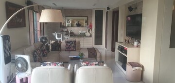 Living Room in 4 BHK Apartment at RMZ Woodsvale, Benson Town – for Sale