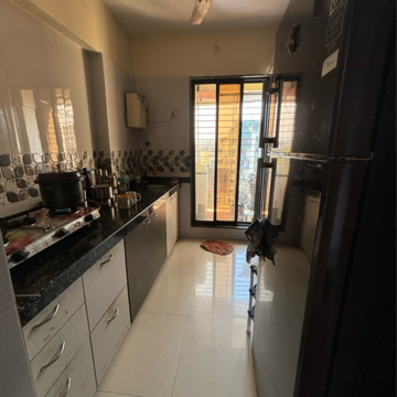 Kitchen in 2 BHK Apartment at Sahayog Nilayam, Titwala – for Sale