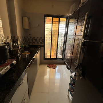 Kitchen in 2 BHK Apartment at Sahayog Nilayam, Titwala – for Sale