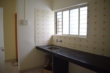 Kitchen in 1 BHK Apartment at Chintamani Bhagwant Rahi Residency, Shivane – for Sale