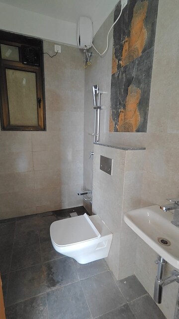 Bathroom in 3 BHK Apartment at Naman Habitat, Andheri West – for Rent
