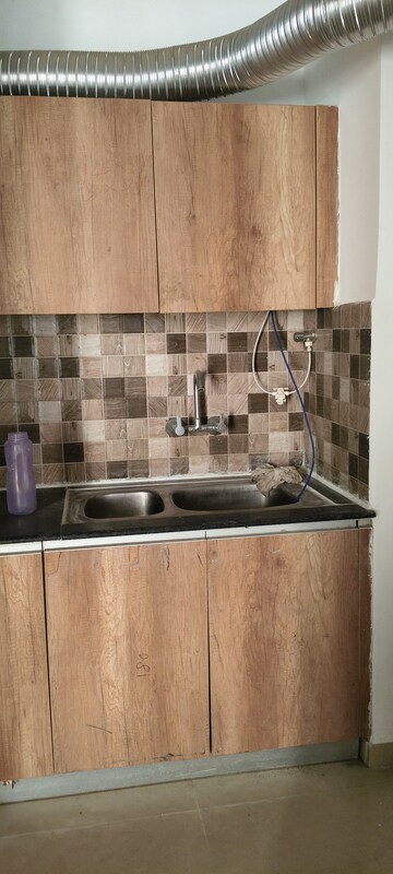 Kitchen in 2.5 BHK Apartment at Prateek Grand Carnesia, Siddharth Vihar – for Rent