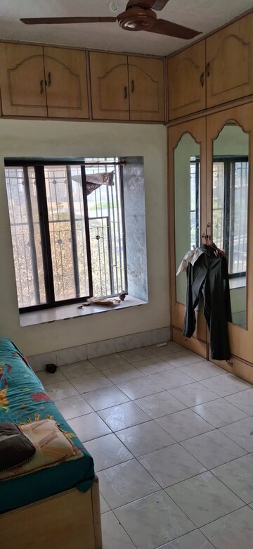 Bedroom in 2 BHK Apartment at Bimbisaar Nagar CHS, Goregaon East – for Rent