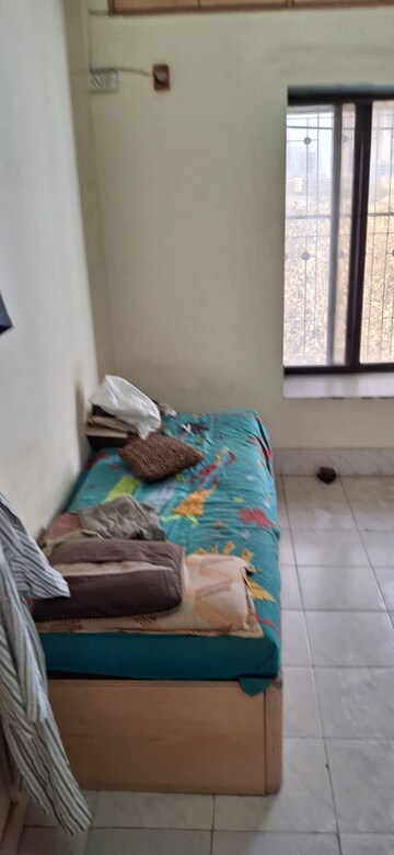 Bedroom in 2 BHK Apartment at Bimbisaar Nagar CHS, Goregaon East – for Rent