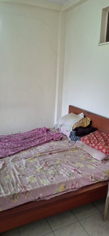 Bedroom in 2 BHK Apartment at Bimbisaar Nagar CHS, Goregaon East – for Rent