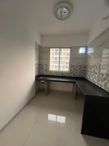 Kitchen in 2 BHK Apartment at Raj Shreeji Iconic, Badlapur East – for Sale