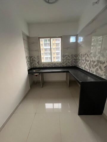 Kitchen in 2 BHK Apartment at Raj Shreeji Iconic, Badlapur East – for Sale