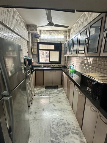 Kitchen in 2 BHK Apartment at Silver Sand CHS, Andheri West – for Rent