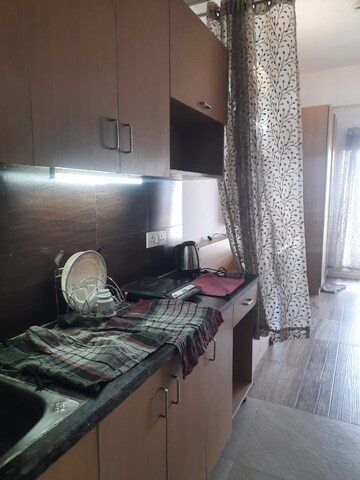 Living Room in 1 BHK Apartment at Paramount Golfforeste, Zeta I Greater Noida – for Rent