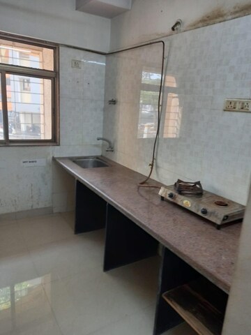 Kitchen in 2.5 BHK Apartment at Rutu Towers, Ghodbunder Road – for Sale
