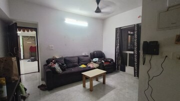 Living Room in 1 BHK Apartment at Lodha Amara, Kolshet Road – for Sale