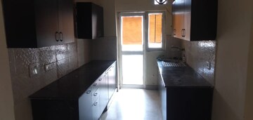 Kitchen in 2.5 BHK Apartment at Aims Golf City, Sector 75 – for Sale