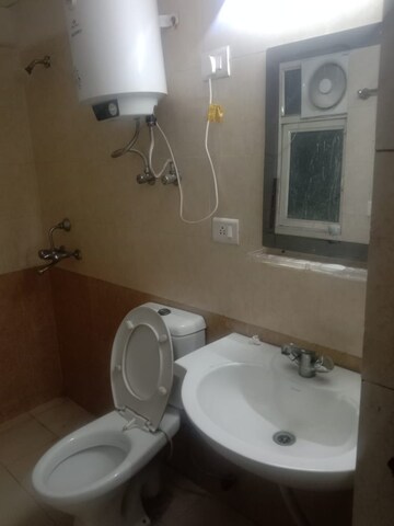 Bathroom in 2 BHK Apartment at Aims Golf City, Sector 75 – for Sale