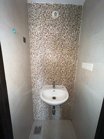 Bathroom in 1 BHK Apartment at Lodha Palava City Lakeshore Greens, Dombivli East – for Rent