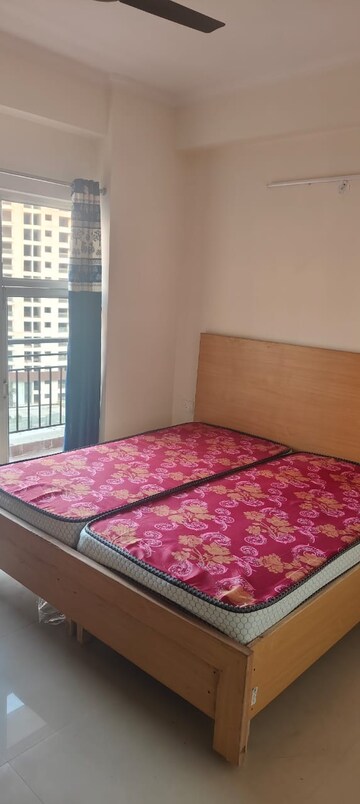 Bedroom in 3.5 BHK Apartment at Aims Golf City, Sector 75 – for Rent