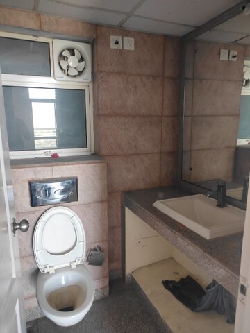 Bathroom in 3 BHK Apartment at Raheja Vedaanta, Sector 108 – for Rent