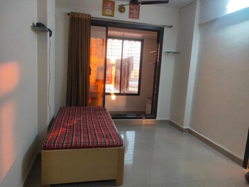Living Room in 1 BHK Apartment at Kopar Khairane – for Rent