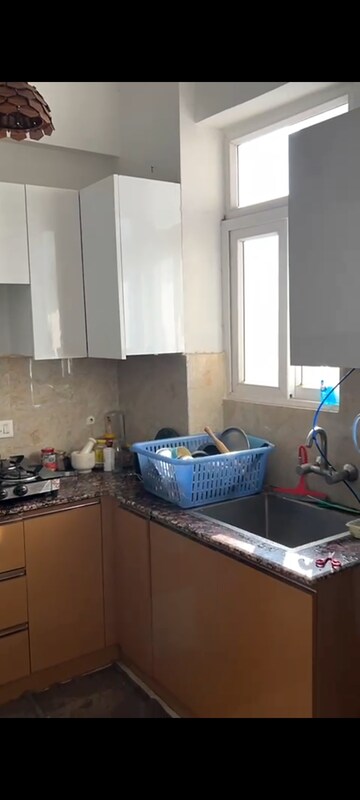 Kitchen in 2.5 BHK Apartment at Amrapali Princely Estate, Sector 76 – for Sale