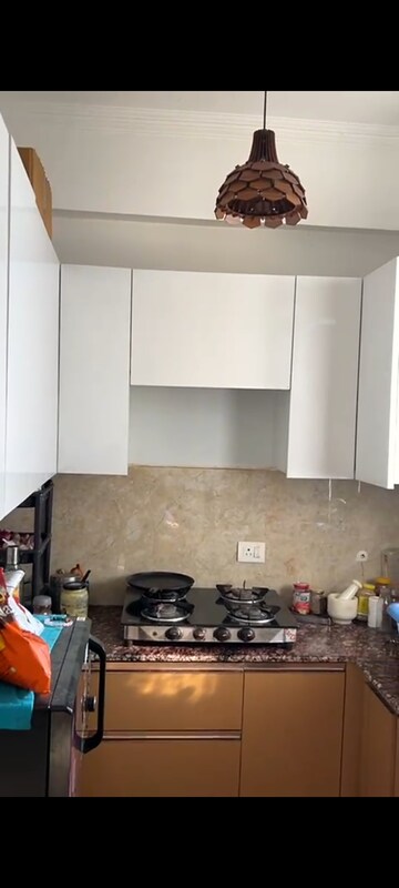 Kitchen in 2.5 BHK Apartment at Amrapali Princely Estate, Sector 76 – for Sale