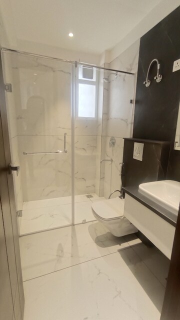 Bathroom in 4 BHK Apartment at Dhakoli Village – for Sale