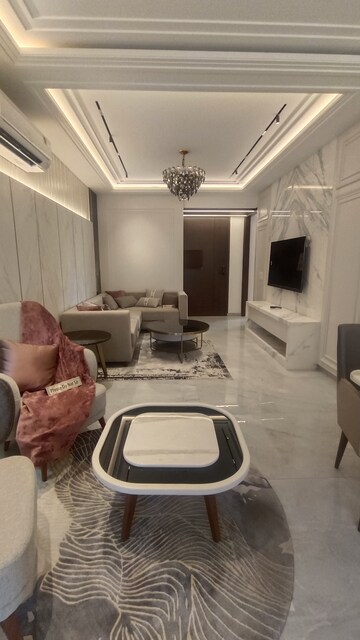 Living Room in 4 BHK Apartment at Dhakoli Village – for Sale
