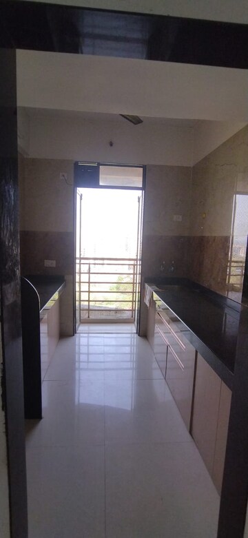 Kitchen in 2 BHK Apartment at Vastusankalp Punyodaya Rio, Kalyan West – for Rent