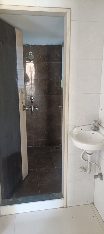 Bathroom in 1 BHK Apartment at Amisha Empire, Mira Road – for Rent