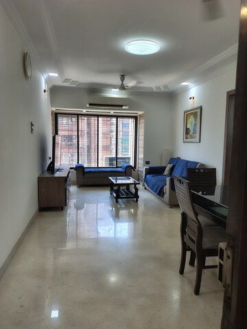 Living Room in 2 BHK Apartment at Indradarshan II, Oshiwara – for Rent