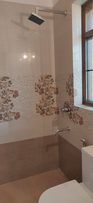 Bathroom in 4 BHK Builder Floor at Ansal Sushant Lok I, Sector 43 – for Rent
