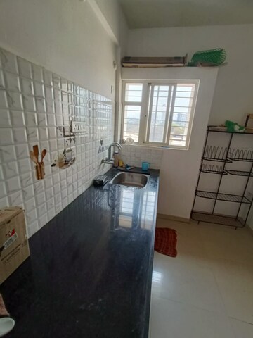 Kitchen in 1 BHK Apartment at Navratna Exotica, Kharadi Bypass Road – for Rent