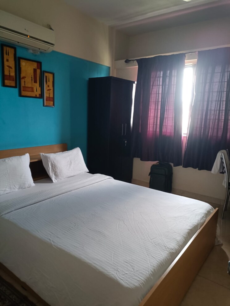 Bedroom, magarpatta-city-cosmos 3 Bedroom 1500 Sq.Ft. Apartment In Kharadi Bypass Road Pune 8367235