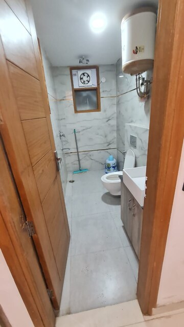Bathroom in 2 BHK Builder Floor at Freedom Fighters Enclave – for Rent