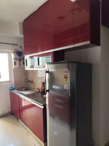 Kitchen in 2 BHK Apartment at Aims Golf City, Sector 75 – for Rent