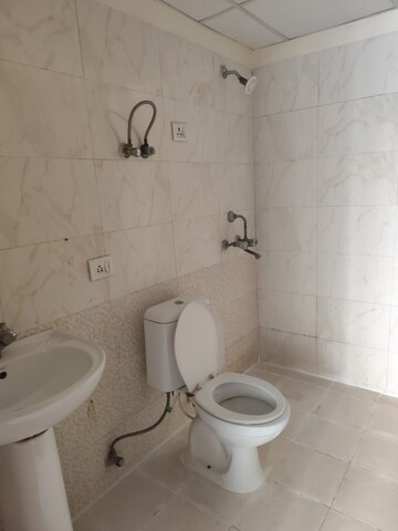 Bathroom in 2.5 BHK Apartment at Aims Golf City, Sector 75 – for Rent