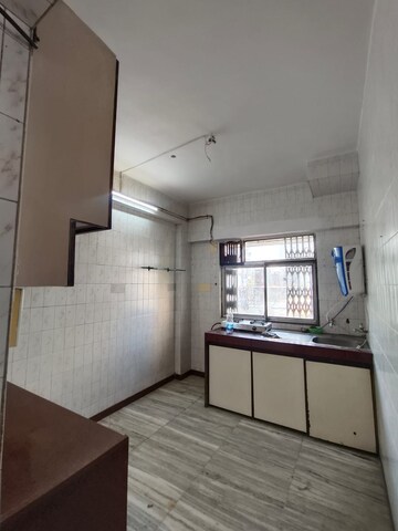 Kitchen in 2 BHK Apartment at Bhagwati CHS, Andheri West – for Rent