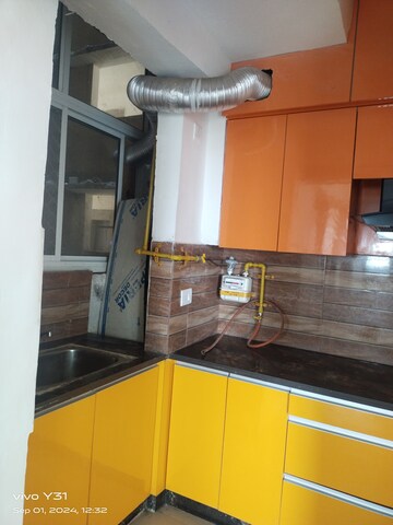 Kitchen in 2 BHK Apartment at Mahagun Mywoods, Sector 16c Greater Noida – for Rent