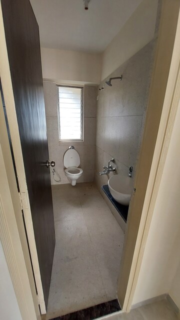Bathroom in 2 BHK Apartment at Bharat Ecovistas, Shilphata – for Sale