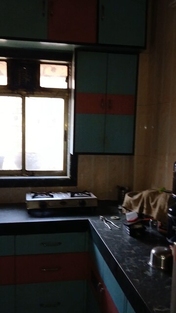 Kitchen in 2 BHK Apartment at Ambika Township, Nana Mava Road – for Sale