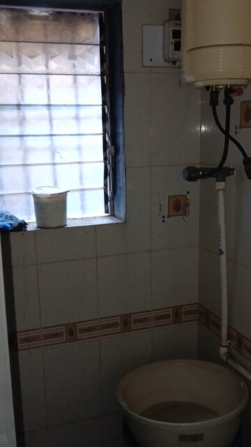 Bathroom in 2 BHK Apartment at Ambika Township, Nana Mava Road – for Sale