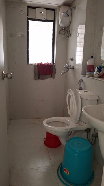 Bathroom in 1 BHK Apartment at Runwal Gardens, Dombivli East – for Rent