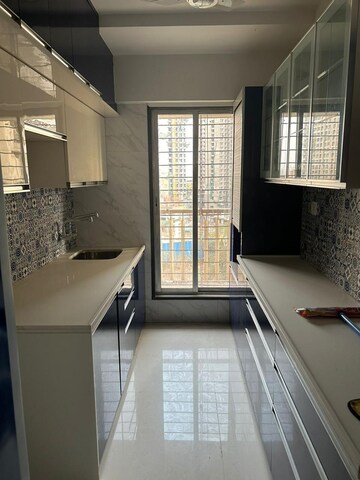 Kitchen in 2 BHK Apartment at Unique Poonam Estate Cluster 2, Mira Road – for Rent