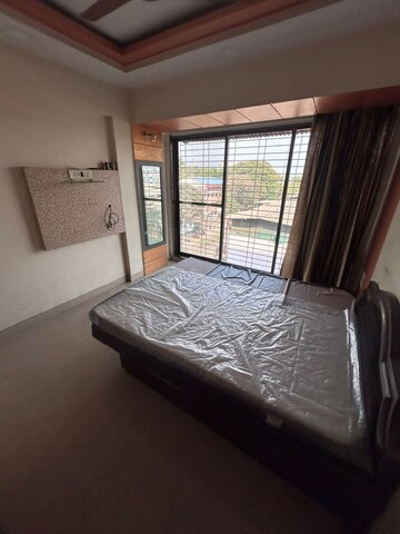 Bedroom in 2 BHK Apartment at Satya Sanskar CHS, New Panvel – for Rent